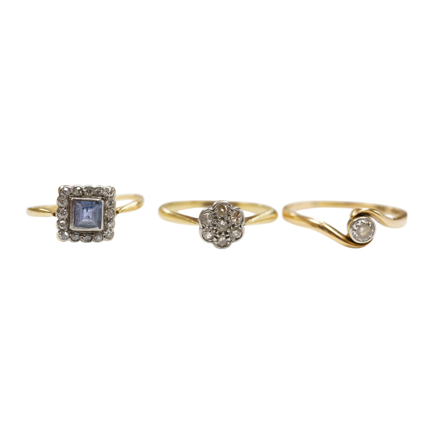 A 1920's 18ct and plat. sapphire and diamond set square cluster ring, size M, and two similar 18ct and diamond set rings, gross weight 7 grams. Condition - poor to fair.